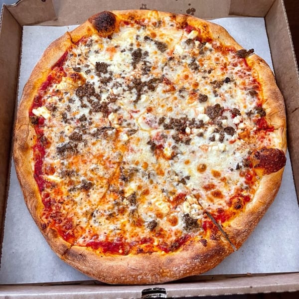 Tony's at Brentwood pizza with sausage, cheese, and tomato sauce in a delivery box.